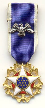A striking medal, like something earned by a Space Ranger at Disney’s Tomorrowland, with an eagle pin and a colorful star emblem.