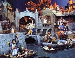 Animatronic pirates and bustling boats energize the iconic Pirates of the Caribbean village scene at Disneyland Park.