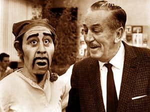 A sharply dressed guest beams at a Jack Sparrow performer, who reacts with a hilariously over-the-top look of surprise.
