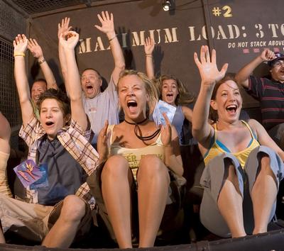 Guests thrill as they scream and throw their hands up aboard the Tower of Terror at Disney’s Hollywood Studios.