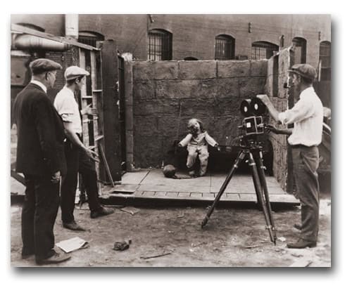 On a vintage Disney backlot, young talent films with classic cameras, capturing the timeless magic of early Disney creations.