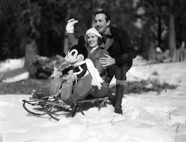 Mickey Mouse joins guests on a snowy sled ride, capturing the playful Disney spirit that continues to enchant fans worldwide.