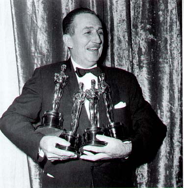 Walt Disney beams in a tuxedo, proudly holding four Oscars—a magical moment celebrating Disney’s legendary legacy.