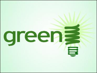 The word "green" shines bright, with a spiral bulb for the "n," glowing like Epcot’s energy pavilion on a vibrant green backdrop.
