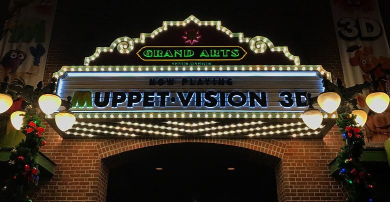 Grand Arts Theater marquee glows at night at Disney’s Hollywood Studios, announcing “Now Playing Muppet*Vision 3D.”.