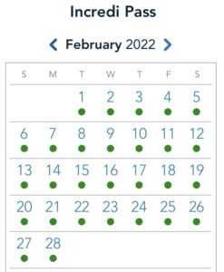 February 2022 Disney calendar showing Incredi Pass reservation availability—green dots mark most dates for Park Pass bookings.