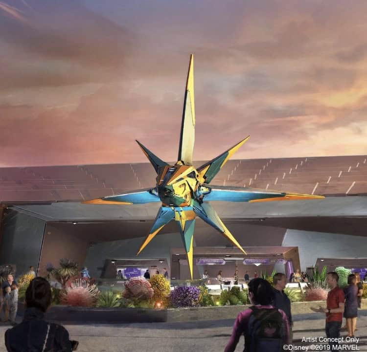 Guests gather at EPCOT's Guardians of the Galaxy: Cosmic Rewind coaster entrance, admiring the iconic Nova Corps Starblaster at sunset.