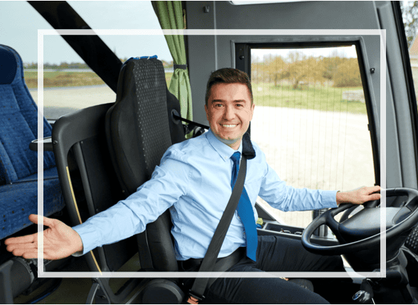 A friendly Mears Connect driver welcomes excited Orlando theme park guests aboard at the airport, ready for magical adventures.