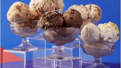 Five Salt & Straw ice cream bowls pop against a blue-purple backdrop, celebrating the sweet arrival at Disney Springs.