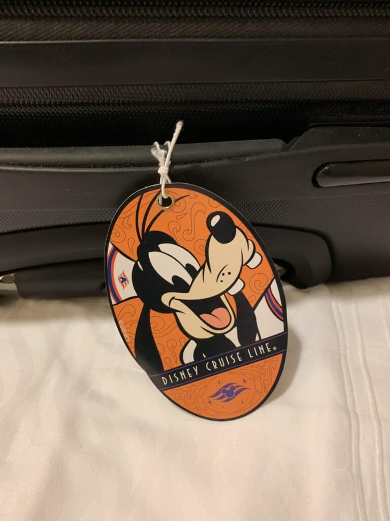Disney Cruise Line luggage tag with Goofy grinning on bright orange—ideal for setting sail aboard Disney Fantasy!.