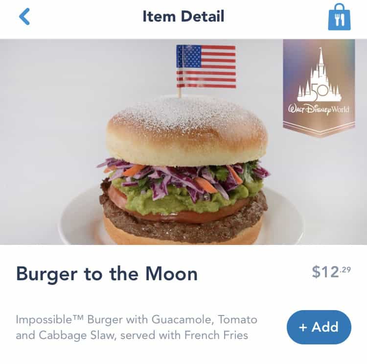 Savor a burger piled high with slaw and guacamole, topped with a US flag—just one delicious Mobile Order bite at Disney World!.