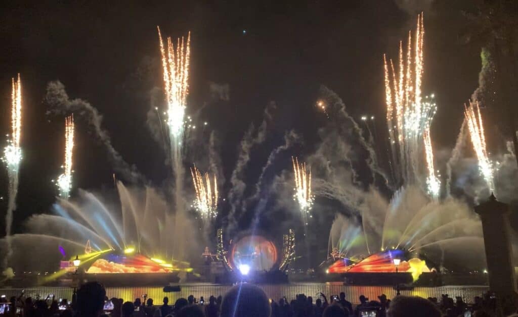 Spectacular fireworks and vibrant lights dazzle over World Showcase Lagoon during EPCOT’s nighttime Harmonious spectacular.