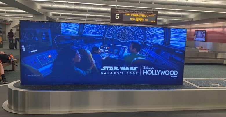 Star Wars: Galaxy's Edge baggage claim display at Disney's Hollywood Studios, promoting the immersive park experience.