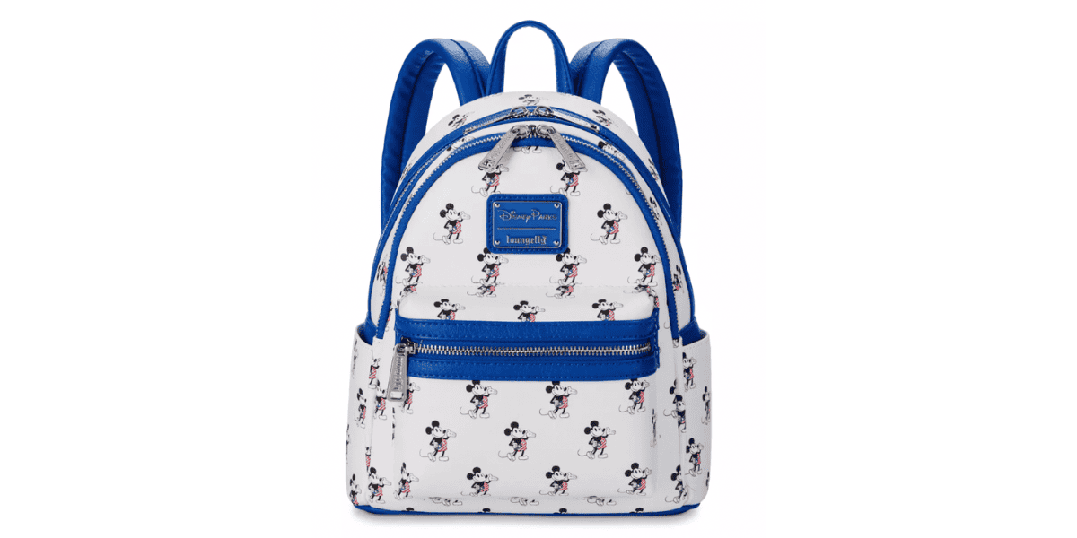A white backpack featuring a pattern of small Mickey Mouse illustrations throughout. The bag has blue straps and trim, with a front zip pocket and a label that says "Disney Parks Loungefly.