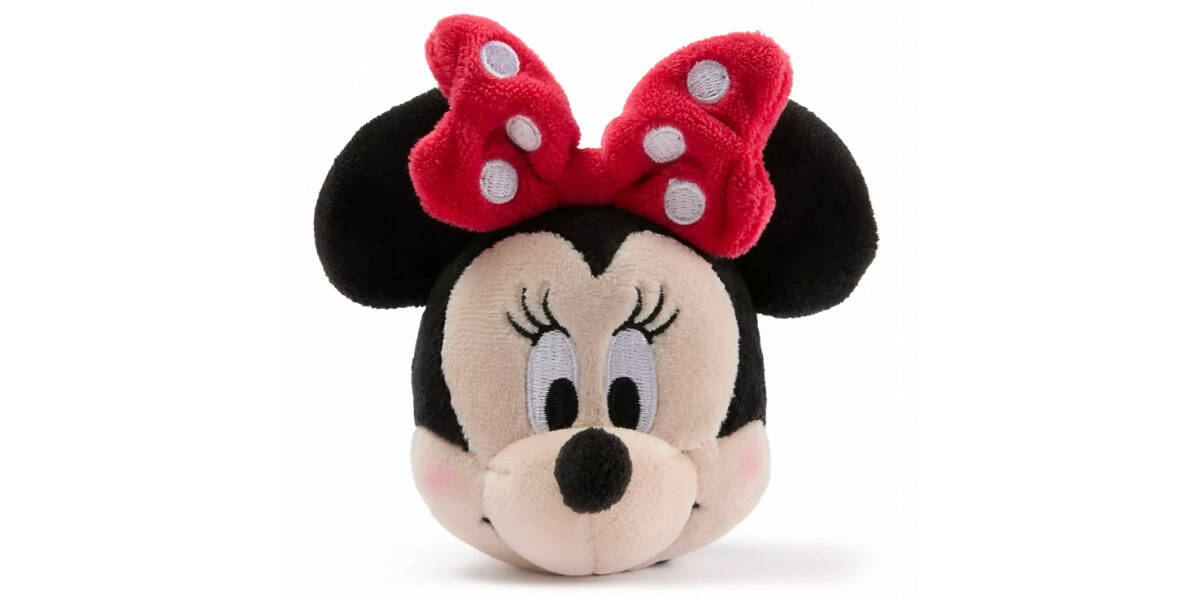 A plush toy of Minnie Mouse's head, featuring large black ears, a red bow with white polka dots, long eyelashes, and a friendly expression.
