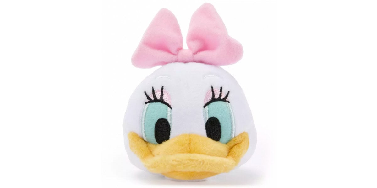 A plush toy of a white duck with large blue eyes, long lashes, a yellow beak, and a big pink bow on its head, resembling Daisy Duck from Disney.
