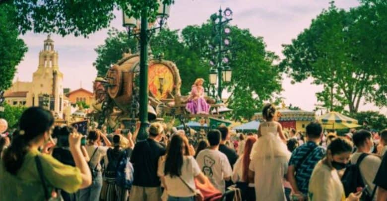 A crowd watches a 'Tangled' parade float at Shanghai Disneyland