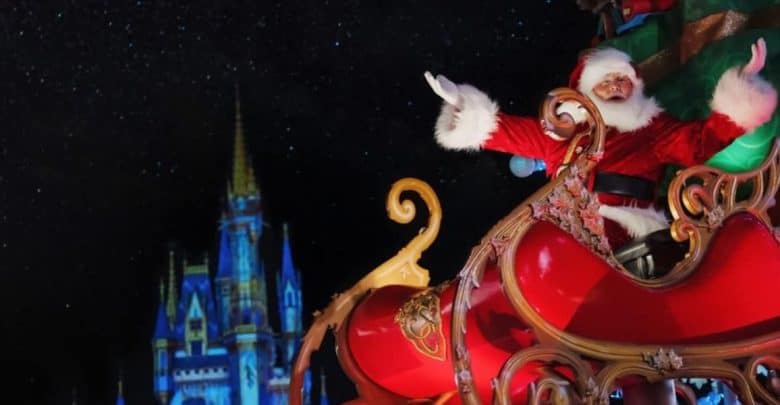 Santa Claus rides in a festive red sleigh at Magic Kingdom
