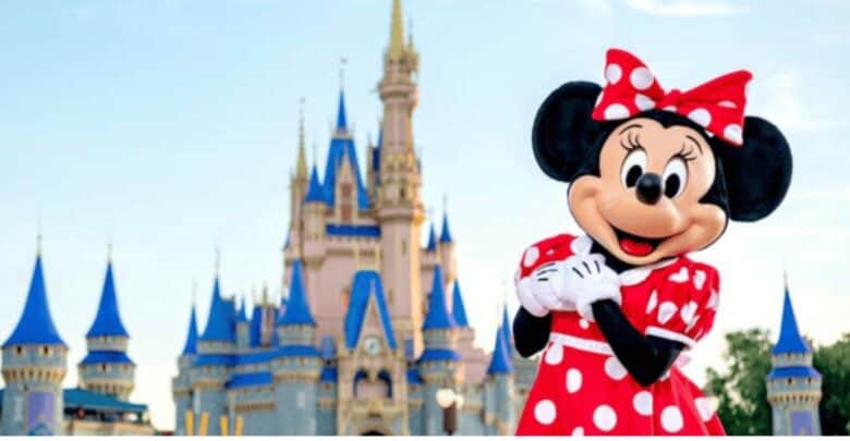 Minnie Mouse posing in front of Cinderella Castle