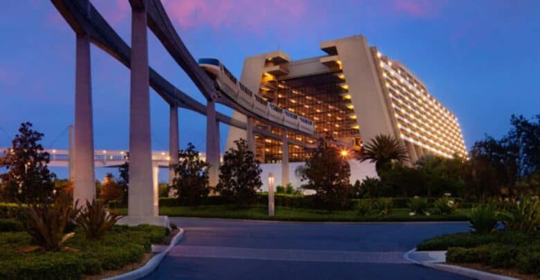 Disney's Contemporary Resort at night with a monorail running through the lobby