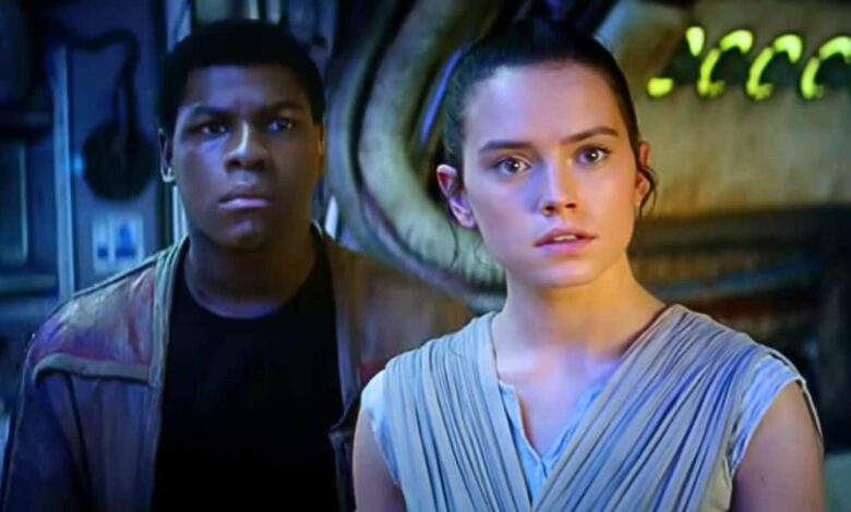 Finn and Rey in the Millennium Falcon cockpit at Star Wars: Galaxy’s Edge.