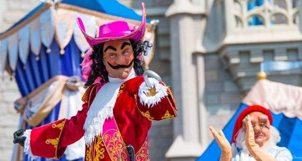 Captain Hook, dressed in his signature red coat and hat, entertains guests live on stage at Walt Disney World.