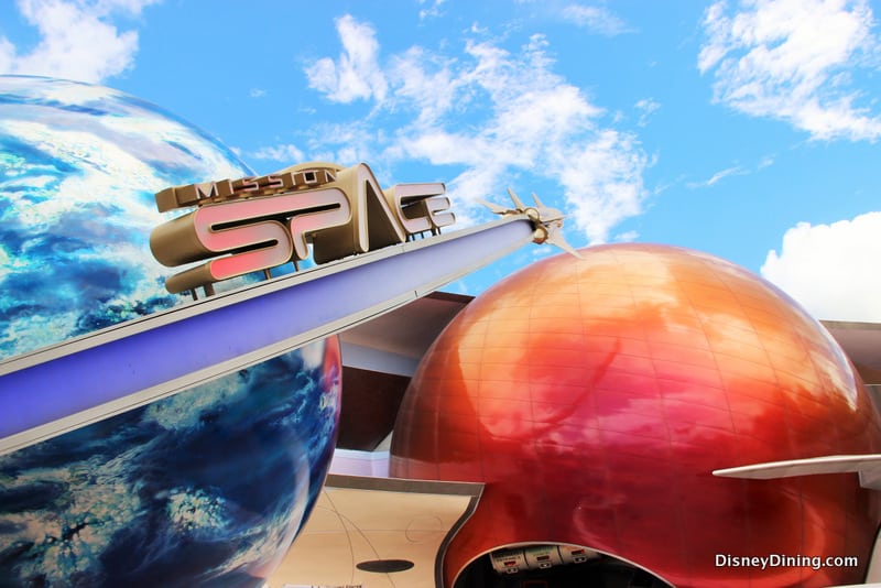Mission: SPACE’s entrance at Epcot wows with massive planet models and a bright sky, drawing thrill-seekers to Walt Disney World.