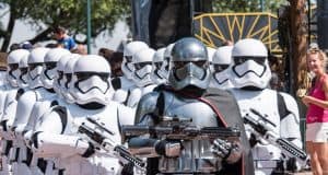 Stormtroopers, led by Captain Phasma, parade through Hollywood Studios as fans look on at this Star Wars favorite in Disney World.