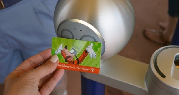 Goofy Passholder card being tapped on a Disney World entry scanner, showcasing insider tips for a magical theme park visit.