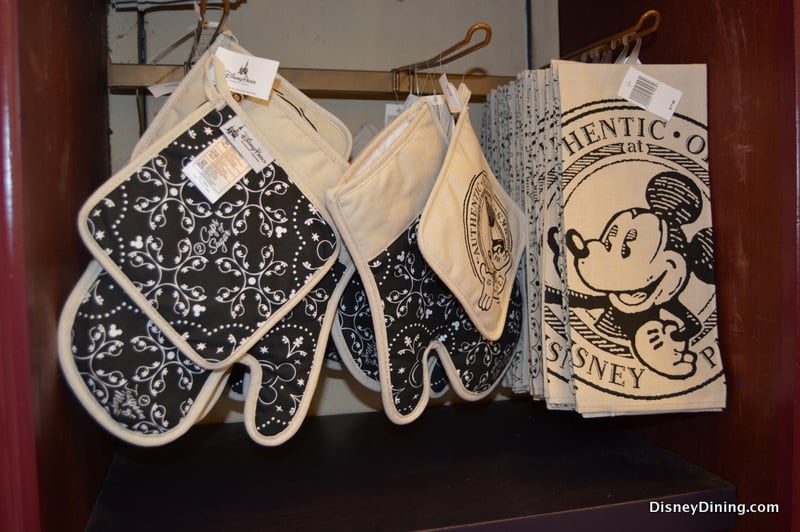 Black and white Mickey Mouse oven mitts, pot holders, and towels bring Disney Parks style to your kitchen shelf.