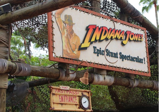 Indiana Jones Epic Stunt Spectacular entrance with Indy on the sign and a Fastpass lane, welcoming fans at Disney’s Hollywood Studios.