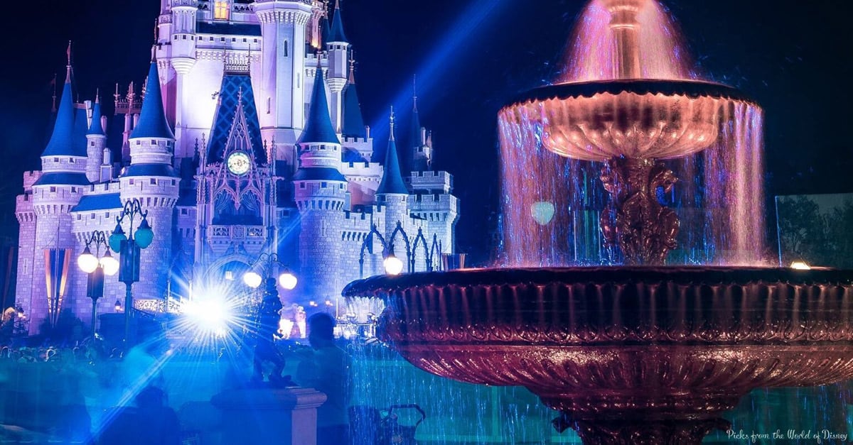 Cinderella Castle and shimmering fountains glow blue and purple at night—ideal for first-time visitors chasing Disney magic.