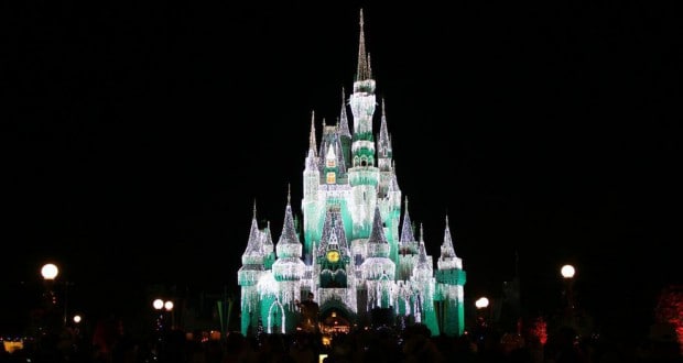 Cinderella Castle dazzles after dark, lit up in white and green, creating unforgettable Disney World nighttime magic.