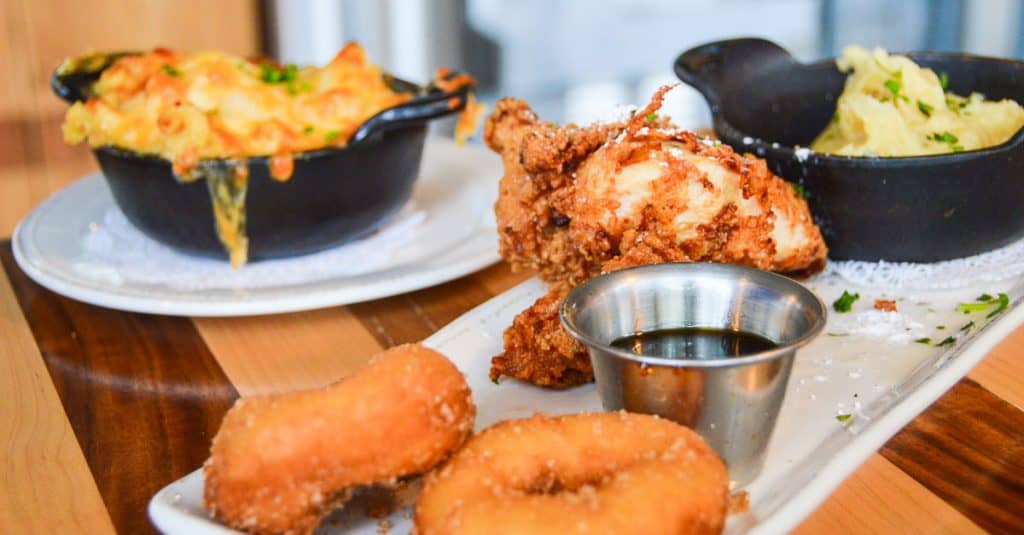 Classic Disney comfort food: fried chicken, mini donuts, macaroni, mashed potatoes, and dip—served at Walt Disney World.