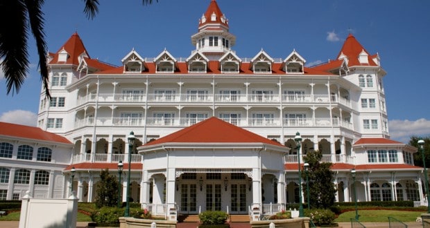 The Grand Floridian Resort, Disney’s elegant Victorian hotel with red roofs and white balconies, set under a bright Florida sky.