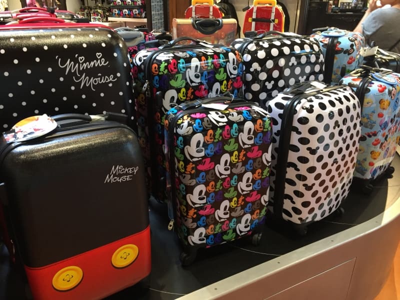 Disney-themed suitcases featuring Minnie and Mickey on display, ready for your next magical trip to Walt Disney World Resort.