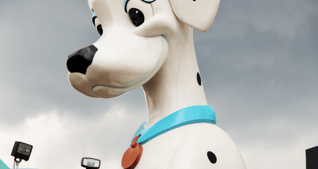 Giant cartoon Dalmatian statue with blue collar and red tag at Disney’s All-Star Movies Resort, perfect for family photo ops.