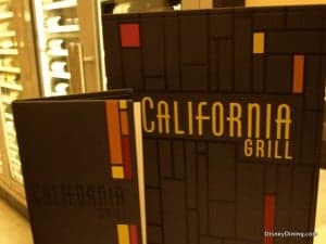 California Grill menus with sleek geometric designs and bold yellow text, reflecting its chic Disney resort atmosphere.