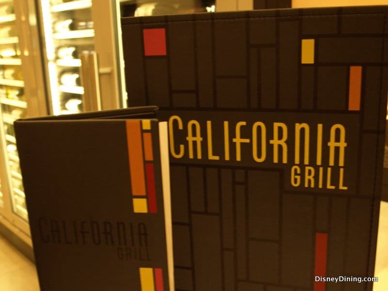 California Grill menus with sleek geometric designs and bold yellow text, reflecting its chic Disney resort atmosphere.