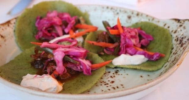 California Grill’s trio of green tortillas with crunchy red cabbage, carrots, and creamy sauce—theme park dining at its freshest!.
