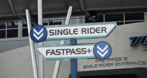 Single Rider and FastPass+ signs at the Disney World entrance—must-know tips for theme park fans optimizing their visit.