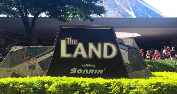 The Land Featuring Soarin’ sign greets guests outside the iconic pavilion, inviting you to explore a fan-favorite at Epcot.