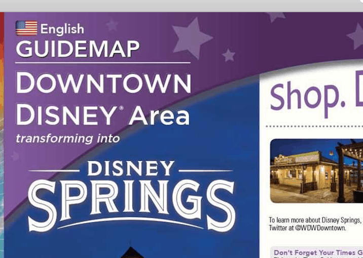 Disney Springs guide map cover highlights the area’s evolution from Downtown Disney, set on a starry purple backdrop.