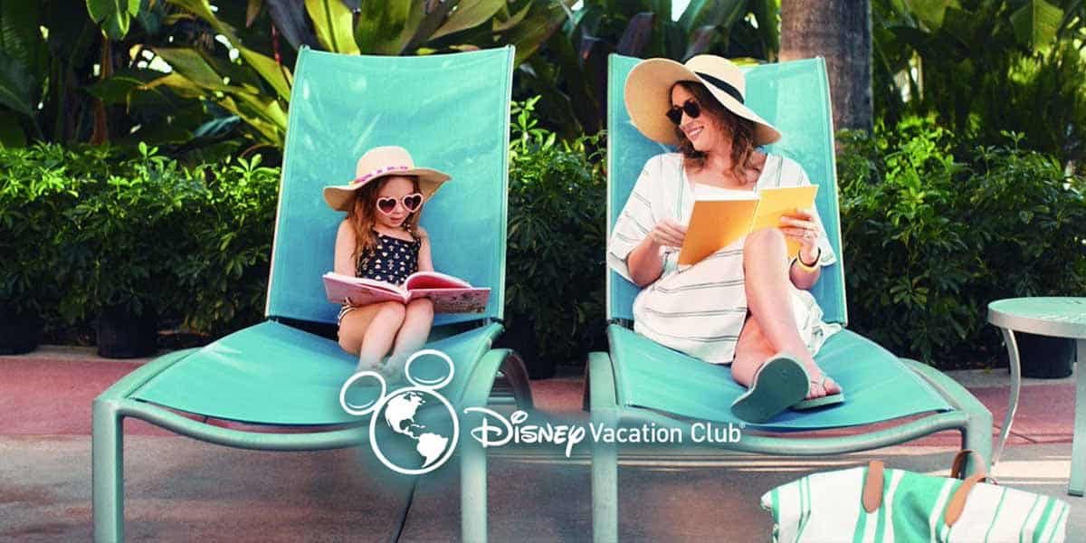 A woman and a young girl relax on turquoise lounge chairs outdoors, both wearing sunglasses and sun hats. The woman reads a book on Disney Vacation Club pros and cons and smiles at the girl, who looks at a picture book. Disney Vacation Club logo is overlaid.