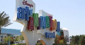Disney’s Art of Animation Resort sign pops with color amid palm trees—an iconic Disney World photo spot for park enthusiasts.