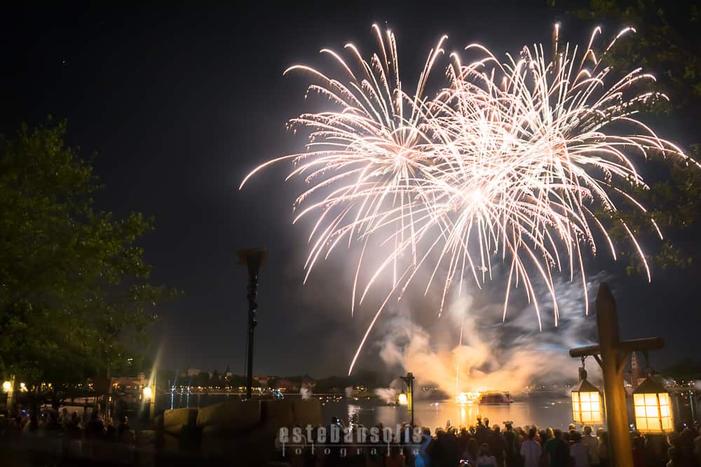 Dazzling fireworks burst over the lake at Walt Disney World, delighting crowds and making a magical end to the park's evening.