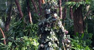 DiVine blending seamlessly into lush foliage along the walking paths at Disney’s Animal Kingdom, adding to the park’s magic.