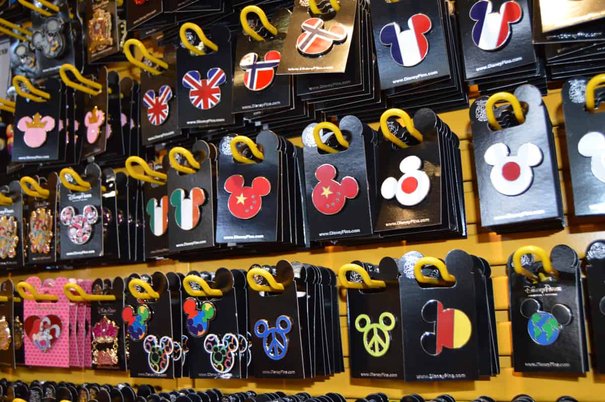 Mickey Mouse head pins featuring global flags are must-have Disney World collectibles for fans and theme park pin traders.