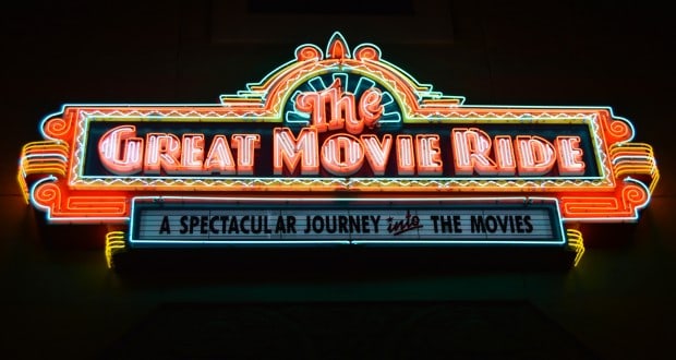 Neon sign for The Great Movie Ride glows, inviting guests at Hollywood Studios to embark on a cinematic adventure.