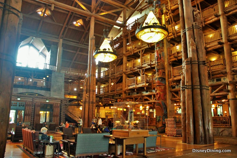 Entering Disney Resort’s grand lodge lobby, guests are wowed by rustic beams, glowing chandeliers, and plush Disney-themed seating.
